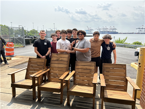  BHS Student pose in front of their freshly built Adirondack style chairs